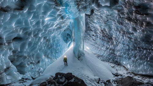When Portland photographer Josh Hydeman first began rappelling into caves a few years ago, his worldview shifted. Rather than encountering a clammy Pandora’s Box of creepy crawlies, he descended past towering glacial columns into ice cathedrals capable of refracting camera flashes into mind-bending lightscapes.
“The general public has never seen a wild cave,” Hydeman says. “They don’t know they’re beautiful, and so they don’t care about them.” As a purveyor of beauty and a skilled mountaineer, Hydeman has made it his mission to illuminate caves and spark interest in what lies beneath—all in an effort to protect what’s not readily apparent.
Mt. Hood, Oregon. January 2015
Come winter, snow builds and this cave transforms into something white and unrecognizable. In 2012, a mapping expedition confirmed it as the longest glacier cave in the contiguous U.S. at 7,166.9 feet. (For Hydeman, this means lugging bags of camera gear and camping equipment up and over even more steep ice.) Unfortunately, ice isn’t coming back as dependably these days—at last check, the cave only measured 1,000 feet.