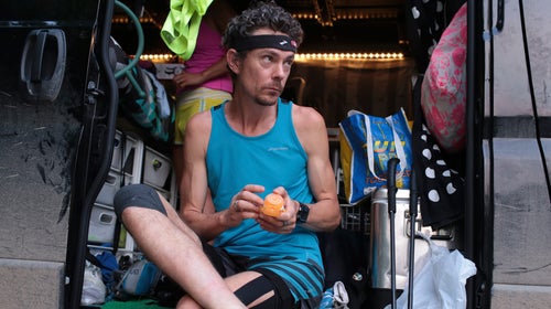 Scott Jurek applies lotion to his feet before running the McAfee Knob Trail on June 11.