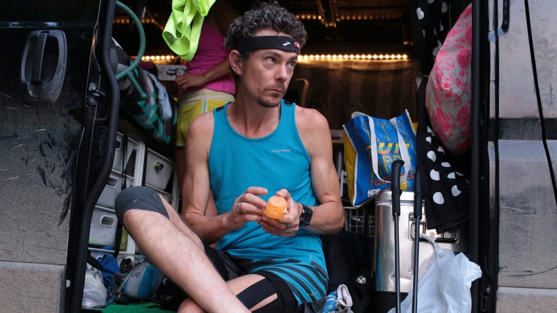 Scott Jurek applies lotion to his feet before running the McAfee Knob Trail on June 11.