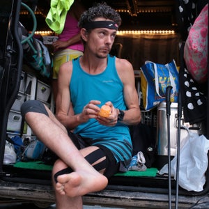 Scott Jurek applies lotion to his feet before running McAffee's Knob trail on June 11.