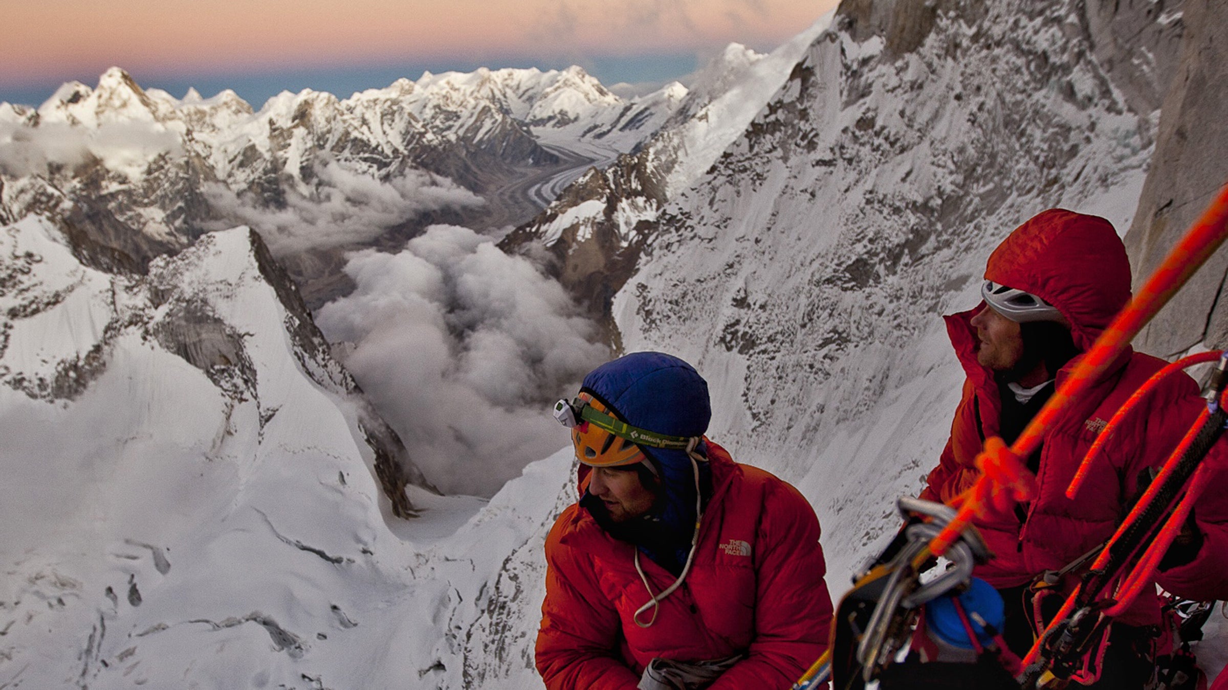 Day 5. Conrad and Renan take a break from
building the portaledge camp at 19,000ft during sunset to look over
the Gangotri Glacier and Shivling.