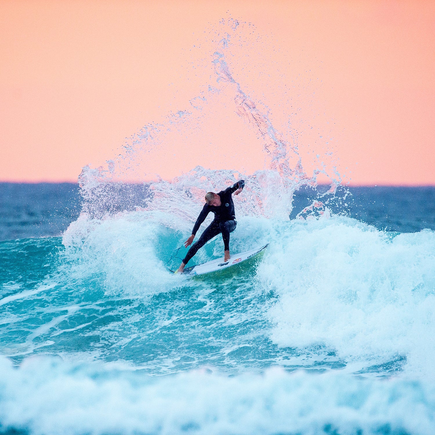 Mick Fanning (pictured surfing in Australia in April 2015) said he felt the great white shark tangle with his leash before the fin surfaced.