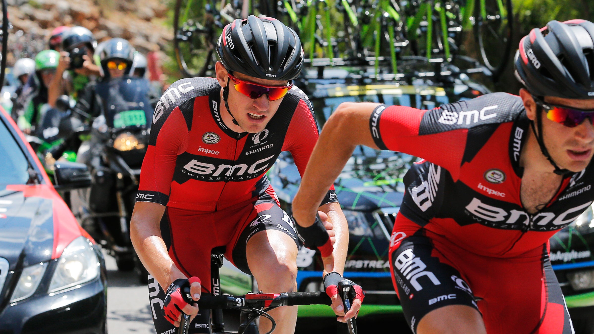 A teammate helps Tejay van Garderen of the U.S., left, after he fell ill during the seventeenth stage of the Tour de France.