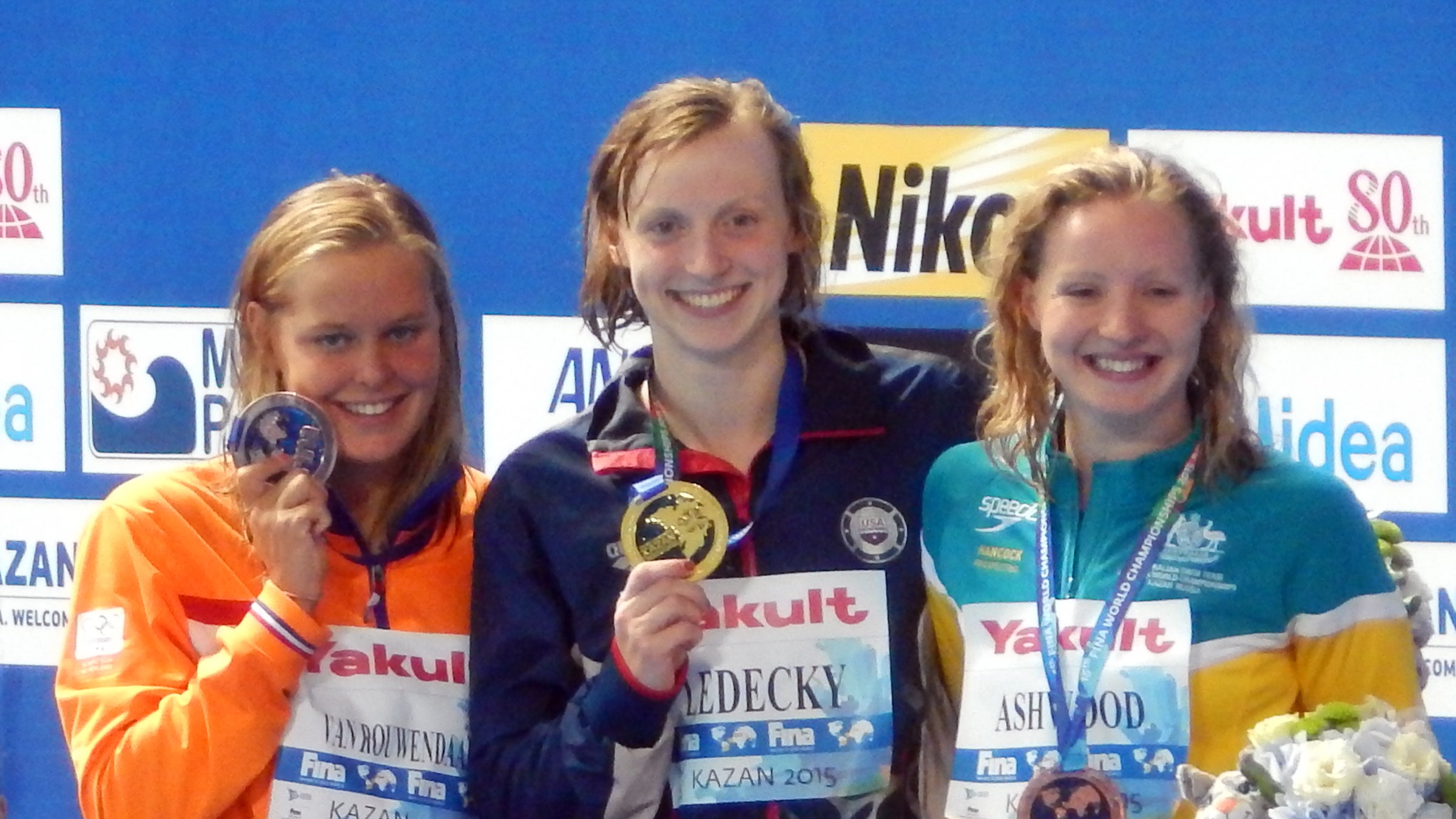 Ledecky (center) is an Olympic gold medalist in the 800-meter freestyle.