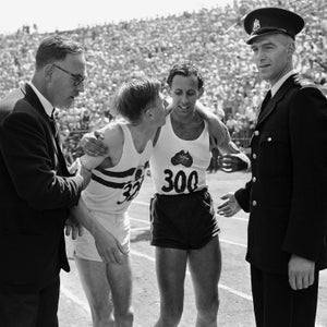 England?s Dr. Roger Bannister, left, puts arm around Australia's John Landy after the mile run in British Empire games in August 1954. Bannister won race in 3:58.8 while Landy finished second in 3:59.6.
