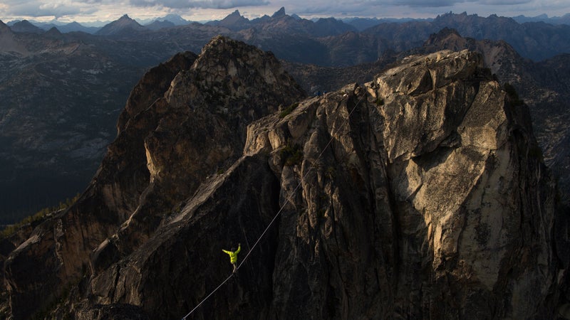 Ben Plotkin-Swing walks a 181-foot highline between the Winter Spires on Washington Pass in the Cascade Mountains, Washington.