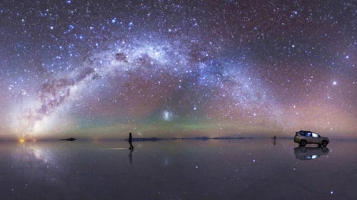 This image was taken in February 2015 at the Salar de Uyuni–the world's largest salt flat–in Bolivia by Chinese photographer Caren Zhao. The arc of the southern Milky Way and the zodiacal light above is reflected almost perfectly, earning the photo fifth place in the Beauty of Night Sky category.
