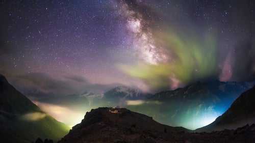 This image was taken by panoramic photographer Evgeny Trisko in the northern Caucasus Mountains in Russia in August 2014. It shows Mount Elbrus and the Peak Terskol Observatory beneath the Milky Way, which is partially obstructed by clouds reflecting lights from the ground. Trisko’s work took second place in the Against the Lights category.