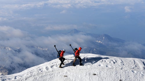 Project 360 alpinists travel on the ridge between the Swiss and Italian summit of the Matterhorn.