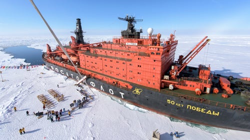The North Pole! After five days at sea, 50 Years of Victory arrives at 90 degrees north on a crystal clear morning. There is no research base, historical marker, or any other indication that you鈥檝e arrived anywhere special鈥攐ther than your GPS. Once we found thick enough ice to disembark, the first order of business was to plant a big, red 鈥淣orth Pole鈥 sign at the pole. Our outfitter Quark had brought along a hot-air balloon, allowing us to float above the pole. The tether can be seen just to the left in the photograph.