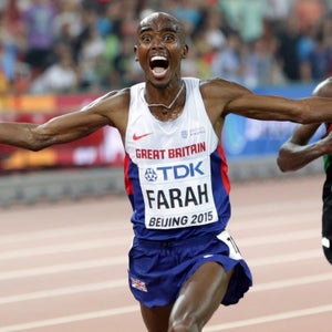 Britain's Mo Farah celebrates as he approaches the finish line to win the gold medal in the men's 10000m World Athletics Championships at the Bird's Nest stadium in Beijing, Saturday, Aug. 22, 2015. (AP Photo/Lee Jin-man)