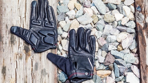 These gloves look slick, but they’re also designed to perform. The water-resistant Pittards WR100X leather cuts the chill on cold mornings and stays supple even after a soaking. Padding on the palm makes for a comfy ride, while smartphone-compatible fingertips let you answer texts, and a soft nose wipe on the thumb ensures you’re tidy when you arrive at the office.