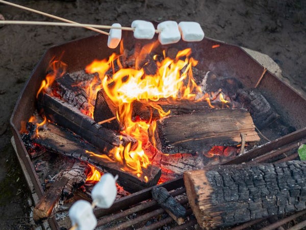 Marshmallows roasting on a fire.