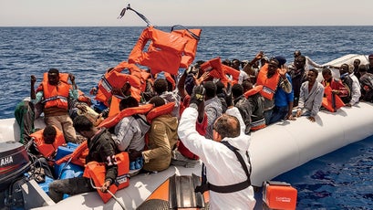 Operations chief Ian Ruggier provides life vests.