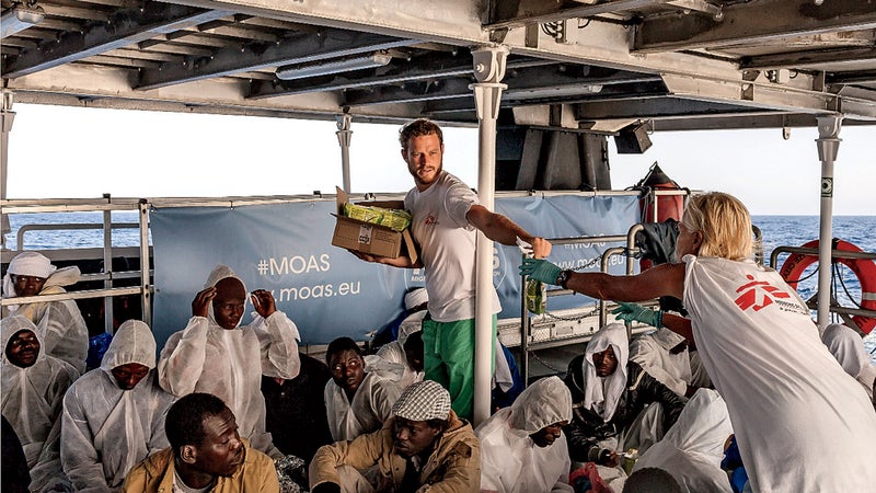 Medics hand out food.