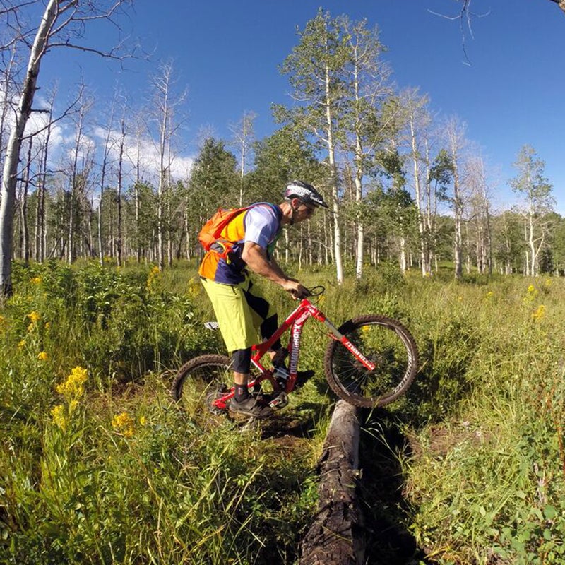 Bunny hopping involves lifting your front and then back wheels over an obstacle, without the help of clipless pedals. First, get into the “ready” position. (See slide 2 for reference.) Just before you hit the log, compress your fork by leaning down on it, and then as it rebounds, shift your weight back and lift your front wheel off the ground so that it just meets the top of the log. Then, in one motion, push your front wheel off the top of the log while shifting your weight forward. Practice on a curb or sidewalk. @portermtb