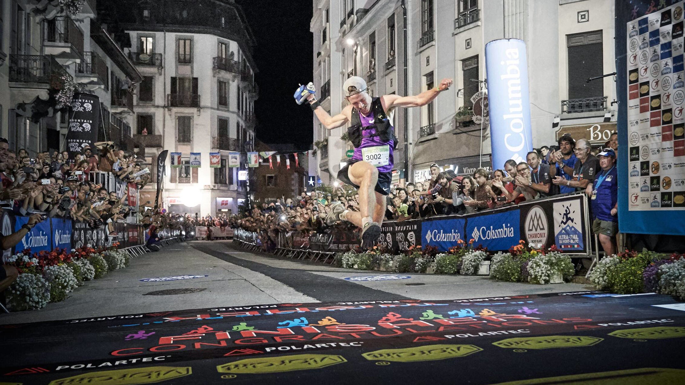 Zach Miller crosses the finish line in first place at the Courmayeur-Champex-Chamonix.