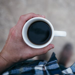 It's not the caffeine—decaf coffee also helps move waste through the body within four minutes of digestion.
