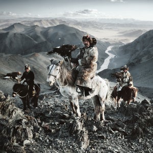 According to photographer Jimmy Nelson, the Before They Pass Away project began nearly 30 years ago when he began walking from one side of Tibet to the other. That’s when he set it upon himself to document the last of the world’s ancient tribes and peoples with his 50-year-old 4x5 film camera. Nelson then spent the next four years traveling across the world to photograph 31 tribes, chosen for their geographical, traditional, and aesthetic importance. He spent two weeks with each photographing and learning a little about their traditions, mannerisms, and beliefs.
Now, each community's images are captured between the covers of his new photography book Before They Pass Away. “My dream had always been to preserve our world’s tribes through my photography,” writes Nelson. “Not to stop change from happening—because I know I can’t—but to create a visual document reminding us, and the generations after us, of the beauty of pure and honest living.” Here, we preview of Nelson’s book and some of the people he encountered. 
Photo: The Kazakhs of the westernmost province of Bayan-Ölgii, Mongolia, are a Turkic people originating from the northern parts of Central Asia and can trace their roots to the 15th century. Most Kazakhs in this remote, mountainous region are dependent on domestic animals for their livelihood and practice the ancient tradition of hunting rabbits, marmots, foxes, and wolves on horseback with the help of trained golden eagles.