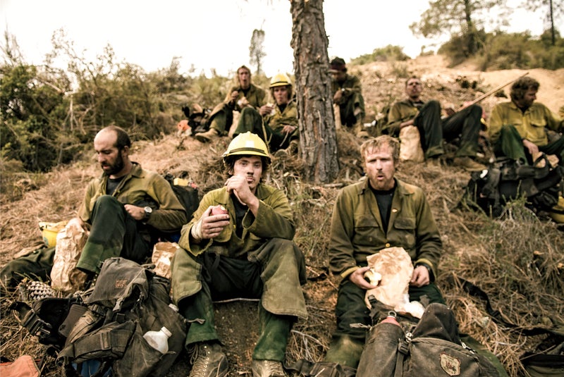 From left: Saeid Sinnukrot, Garrett Hekhuis, and Tony Barbero eat lunch during last year's Mill Fire.