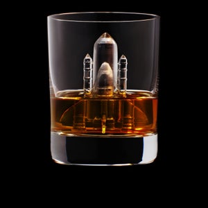 MANDATORY CREDIT: Suntory Holdings Limited/Rex Features. Only for use in story about Suntory Holdings Limited's work. Editorial Use Only. No stock, books, advertising or merchandising without photographer's permission.
Mandatory Credit: Photo by Suntory Holdings Limited/REX Shutterstock (2068060e)
A rocket
Liquor company creates world's first 3d-milled ice sculptures, Japan, Apr 2014
FULL BODY: http://www.rexfeatures.com/nanolink/otkr 
We have all tried novelty ice cubes, but have ever wanted to cool your whiskey with an ice-sculpted mermaid?
Soon whiskey on the rocks may be a thing of the past. A Japanese liquor brand Suntory has created the world's first 3D printed ice cubes to accompany your favourite drinks. 
'3D On The Rocks' is the latest advertising campaign for Suntory. They joined forces with advertising agency TBWAHakuhodo to create incredibly detailed 3D-milled ice cubes.