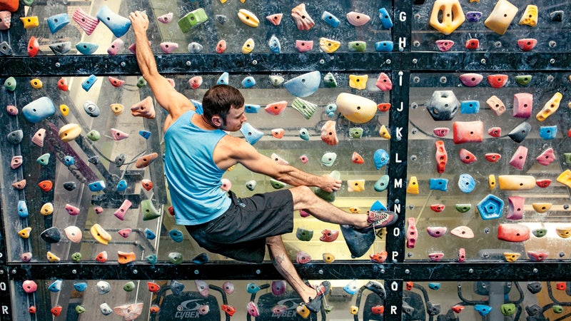 Route setter Max Zolotukhin at Planet Granite in San Francisco.