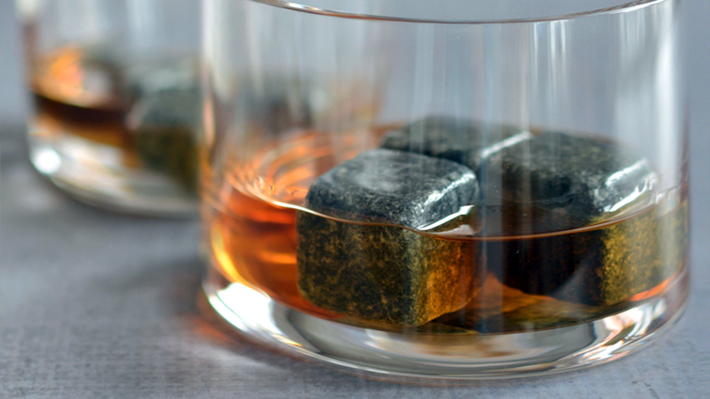 Whiskey stones will chill your drink but won't dilute the taste.