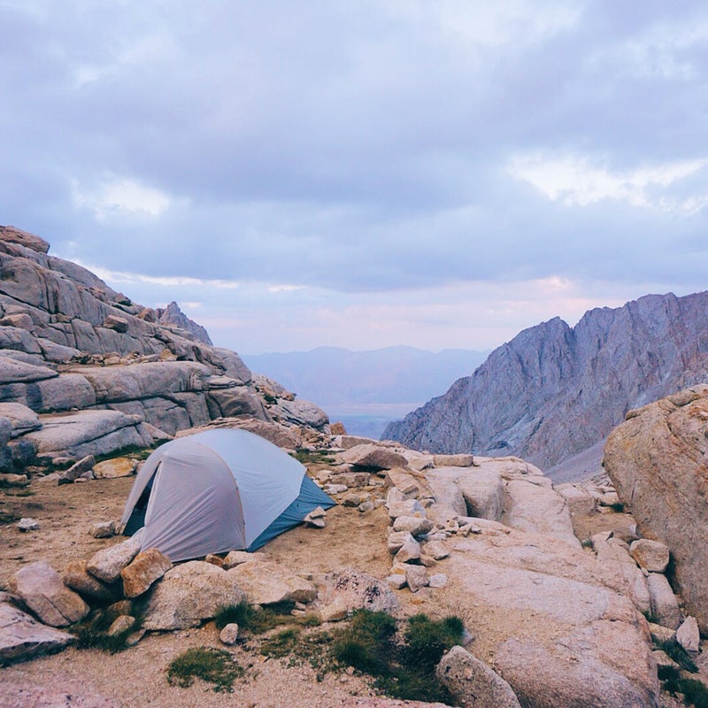 I take images with whatever is handy, but generally I like to take photographs with my mirrorless camera or my SLR. When it comes to landscape or astrophotography, these tools get me a lot closer to creating the image I see or have in mind.
This image was taken on my last night of my JMT hike, when I found a campsite off the trail below Mount Whitney that had an incredible view. I got an insane sunset and I spotted a coyote loping along in the distance. In the morning I woke to fog drifting over the lake and burning off in the early sunshine.