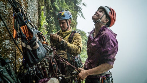 In the spring of 2015, National Geographic Resident Explorer and my good friend, Mike Libecki, called me and said he had an idea to climb a remote tower in the jungle of Ua Pou Island, French Polynesia. “There will be moments that you wish you never came,” he said. Oddly enough, that was exactly what my filming partner Keith Ladzinski and I wanted to hear, as the best expeditions usually hold a good bit of struggle. Plus, Libecki has a knack for finding the most unexplored and uncharted climbing locations on the planet and being the first to summit.
For this expedition, Libecki enlisted Angie Payne to be his climbing partner. Payne, after a successful trip to Greenland with Libecki in 2012, made the mistake of telling Libecki she would go on any “crackpot” mission he ever conjured up. The only issue was that Payne had never climbed a big wall before. But Libecki wasn’t looking for climbers as much as he was looking for people that could take the suffering. In that way, we were all a perfect fit.
We set out on the 21-day mission this March, and after 16 days of debris-filled climbing in horrible conditions, Libecki led us to the summit of Poumaka in a tropical storm.
Photo: Libecki and Payne with unknown pitches and struggle above them.