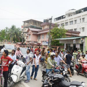 Indian residents gather in the street following an earthquake, in Siliguri on April 25, 2015.  A powerful 7.9 magnitude earthquake struck Nepal, causing massive damage in the capital Kathmandu with strong tremors felt across neighbouring countries.   Witnesses and media reports said the quake tremors lasted between 30 seconds and two minutes and were felt across the across the border in India, including in the capital New Delhi.  AFP PHOTO  / Diptendu DUTTA