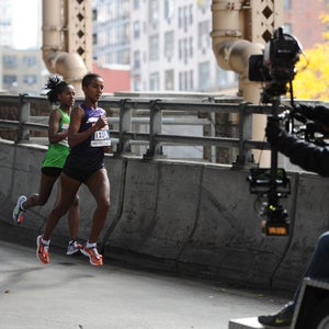 Two lead pack runners folioed by a television camera  make their way across the Ed Koch Queensboro Bridge while participating in the ING New York City Marathon in New York, NY, on November 3, 2013. (Photo by Anthony Behar/Sipa USA)