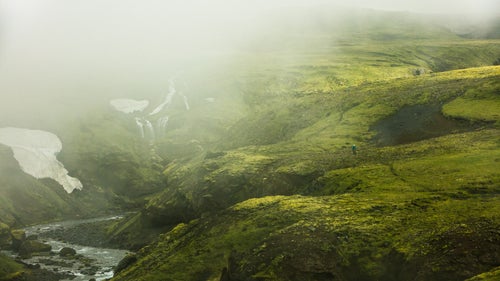 High above Sko虂gafoss Falls and beyond the reach of the shutterbug tourist lies a primitive trail that traces the edges of the river gorge. Countless waterfalls line the edges of the gorge, filling the river with runoff from glacial ice and snow.