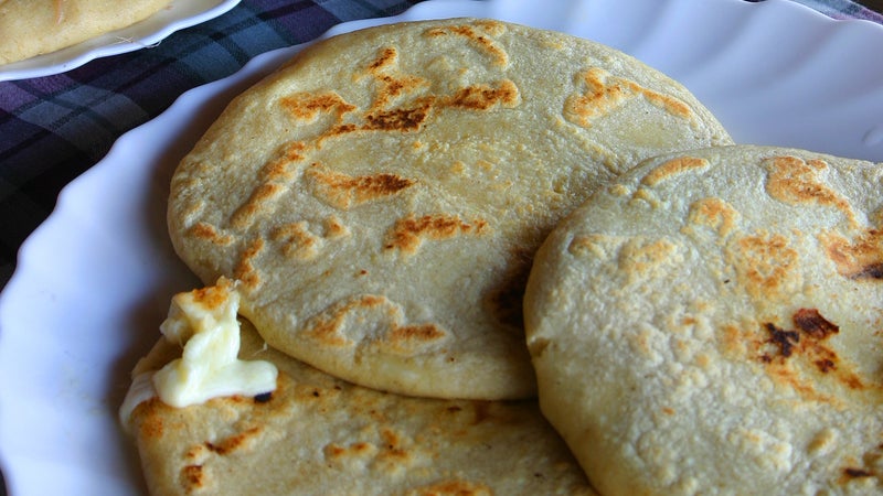 Pupusas stuffed with cheese.