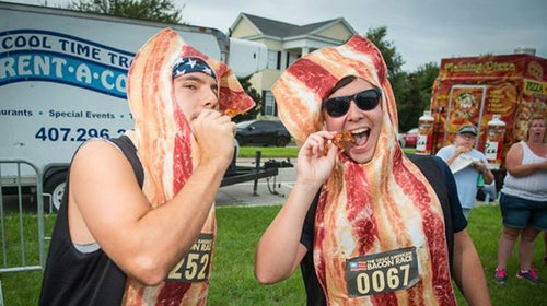 Participants at the Great American Bacon Race are offered fresh bacon at aid stations.