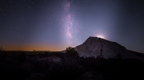 Moonset over the volcanic tuff mountain of Crystal Peak, Utah.