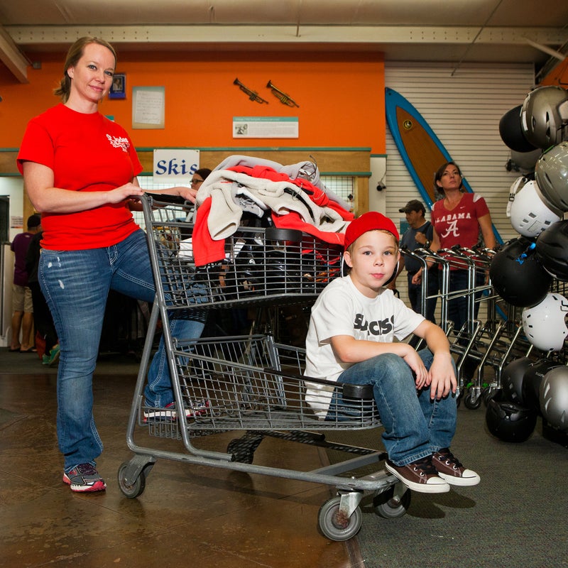 Alicia Kidwell and her husband, Jeff, have been coming to the annual sale for 13 years. They now bring their 7-year-old twins Tyler and Taylor (pictured).