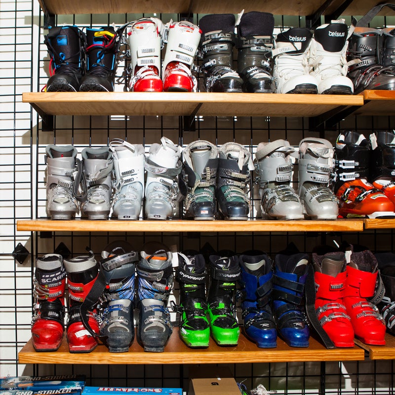Racks of boots, including options from Scarpa and Dynafit, wait for anxious buyers.