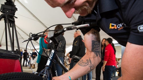 Optum pro cyclist Brad Huff shows off his tattoo, a tradition inside the peloton among riders committed to competing clean.