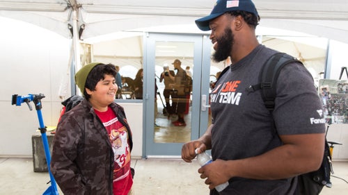 Brandon, 7th grade, chats with rookie Garrison Smith.