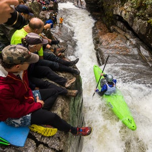 In the whitewater mecca of Asheville, North Carolina, the first Saturday of November belongs to the Green River Narrows Race. First established 20 years ago by a group of 16 hard-charging locals, the race has grown into one of the country’s most competitive and respected, with the biggest names in the sport returning year after year to battle it out.
There’s no money on the line and no barrier to entry. But it’s been called the Super Bowl of Kayaking for good reason. The raucous audience packs the tight canyon walls of what locals call the bedrock coliseum to watch. As photographer John Webster discovered, it’s also damn good time. 
Photo: The three-quarter-mile-long course is notoriously brutal, taking paddlers through a chain of powerful class V rapids punctuated by a narrow 18-foot drop dubbed Gorilla. But it’s what happens out of the water that sets the Green race apart: whereas most backcountry whitewater competitions only draw a handful of spectators, the Green packs the crowd ten-deep, with spectators just feet from the the river, their cheers and hollers blasting off the tight canyon walls.