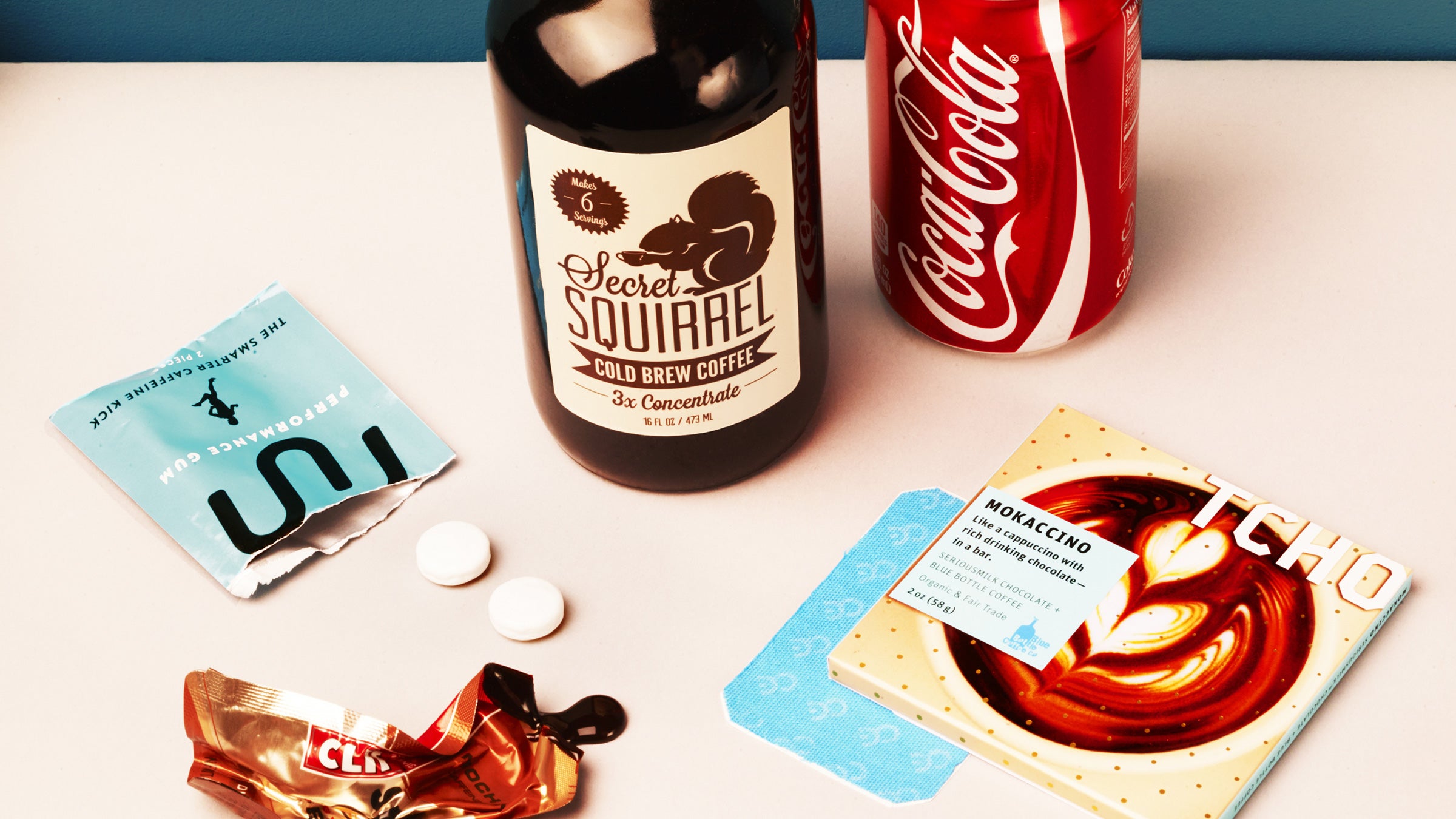 Clockwise from left: Run Gum, Secret Squirrel Cold-Brew coffee concentrate, Coca-Cola, Tcho Mokaccino chocolate, Clean Energy patch, and Clif Shot energy gel.