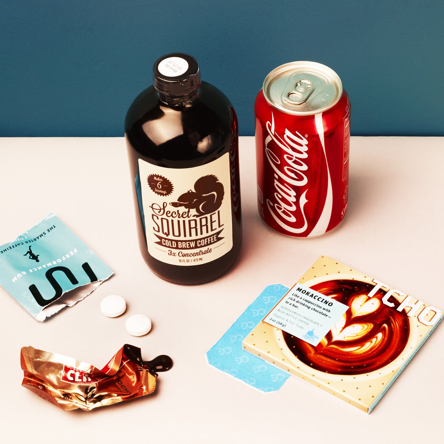 Clockwise from left: Run Gum, Secret Squirrel Cold-Brew coffee concentrate, Coca-Cola, Tcho Mokaccino chocolate, Clean Energy patch, and Clif Shot energy gel.