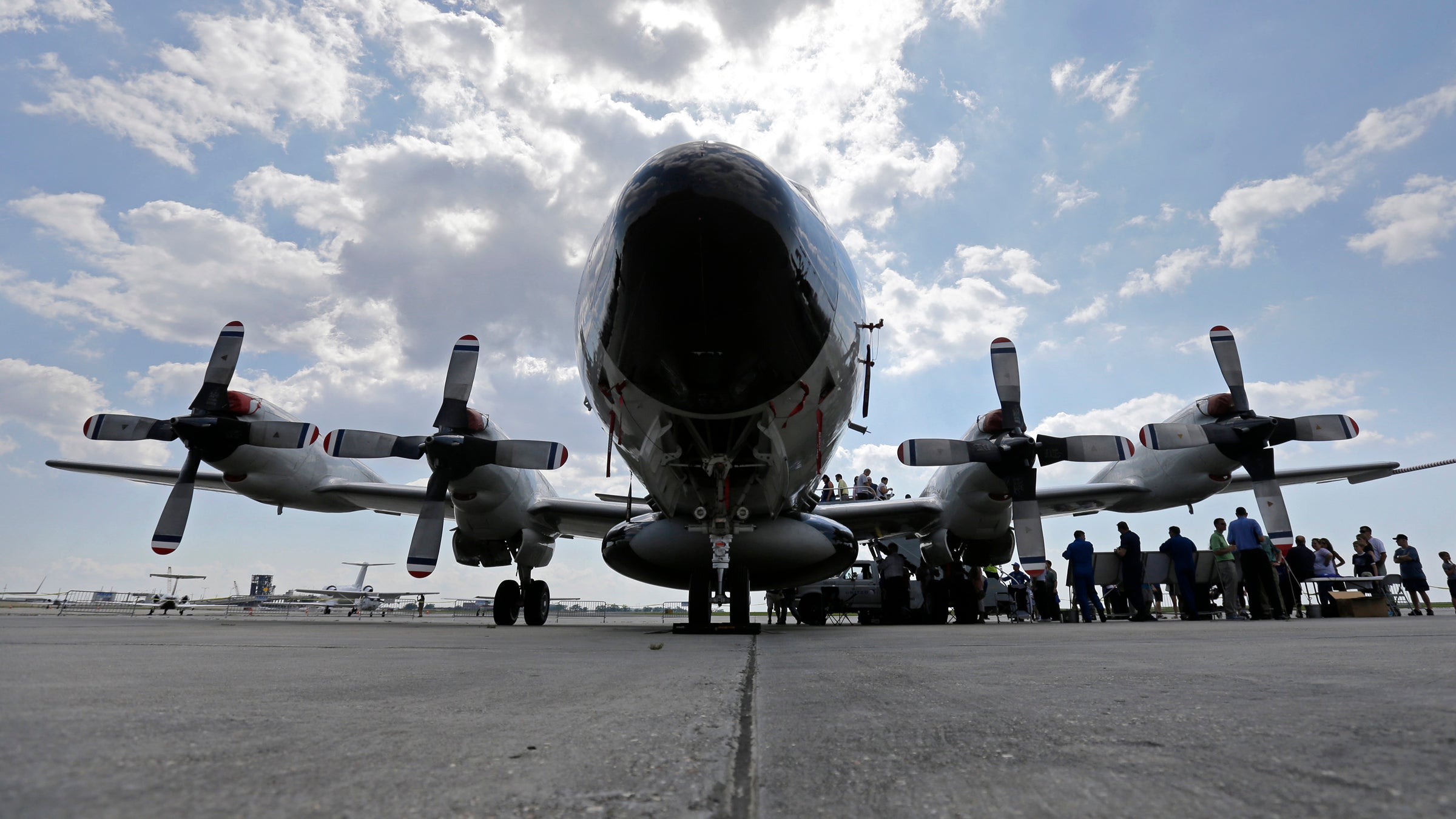 Visitors line up to tour the National Oceanic and Atmospheric Administration's WP-3D Orion turboprop 'Hurricane Hunter' at New Orleans Lakefront Airport.