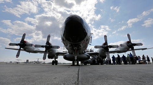 Visitors line up to tour the National Oceanic and Atmospheric Administration's WP-3D Orion turboprop 'Hurricane Hunter' at New Orleans Lakefront Airport.