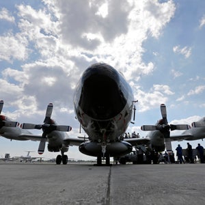 Visitors line up to tour the National Oceanic and Atmospheric Administration's WP-3D Orion turboprop 'Hurricane Hunter' at New Orleans Lakefront Airport in New Orleans, Wednesday, May 21, 2014. The aircraft is  used by scientists on research missions to study various elements of a hurricane, flying through the eye of the storm several times each flight. The plane is also visiting Corpus Christi, Texas, Houston, Tallahassee, Fla.; and Tampa, Fla. (AP Photo/Gerald Herbert)