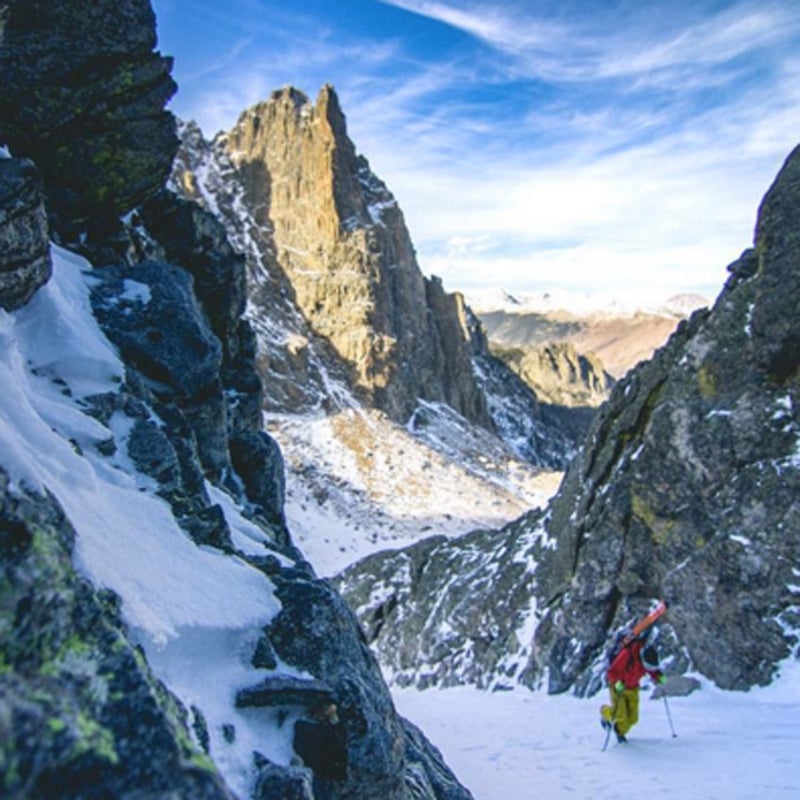Van-based adventure photographer Thomas Woodson skins up a run amidst the five commanding spires known as the Ptarmigan Towers.