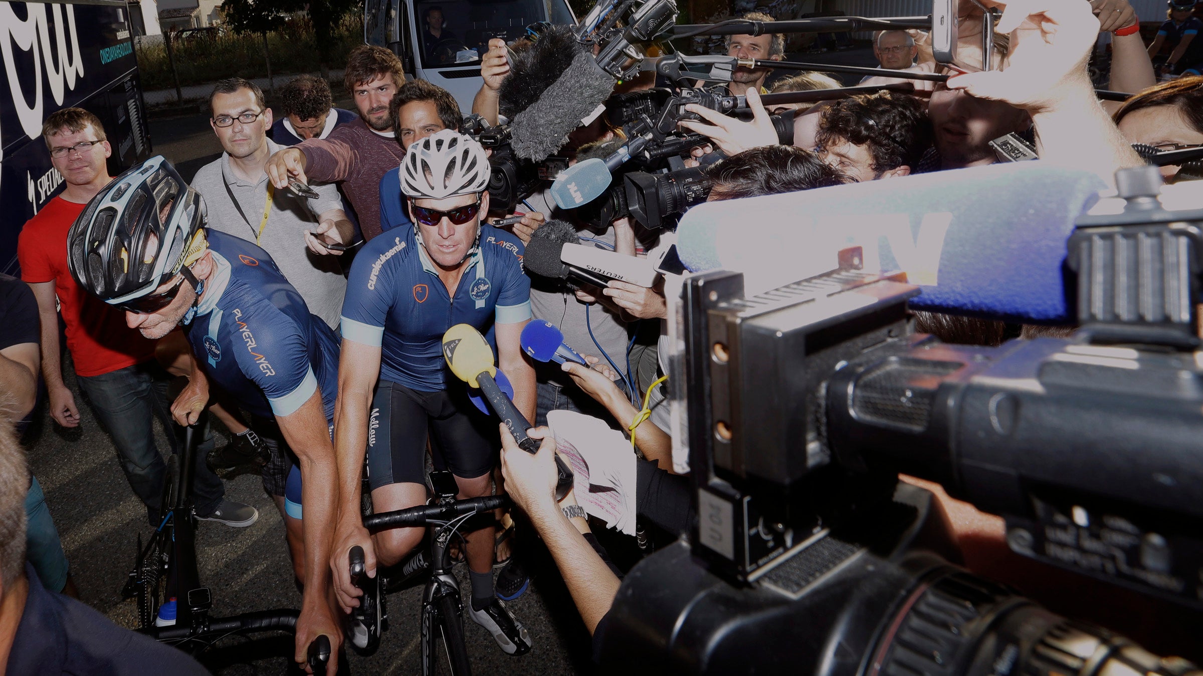 Lance Armstrong, center, during the charity ride Le Tour-One Day Ahead in July. 
