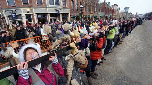 Breckenridge residents and tourists tilt up hundreds of bolted-together skis for a group shot of spearmint schnapps at the 2016 Ullr Fest.