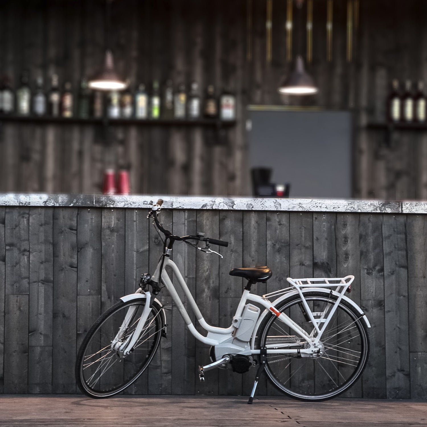 electric bicycle old style in a wooden front bar