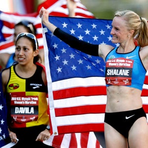 First-place finisher Shalane Flanagan, right, waves as she celebrates with second-place finisher Desiree Davila, left, after running the U.S. Olympic Trials Marathon Saturday, Jan. 14, 2012, in Houston. (AP Photo/David J. Phillip)